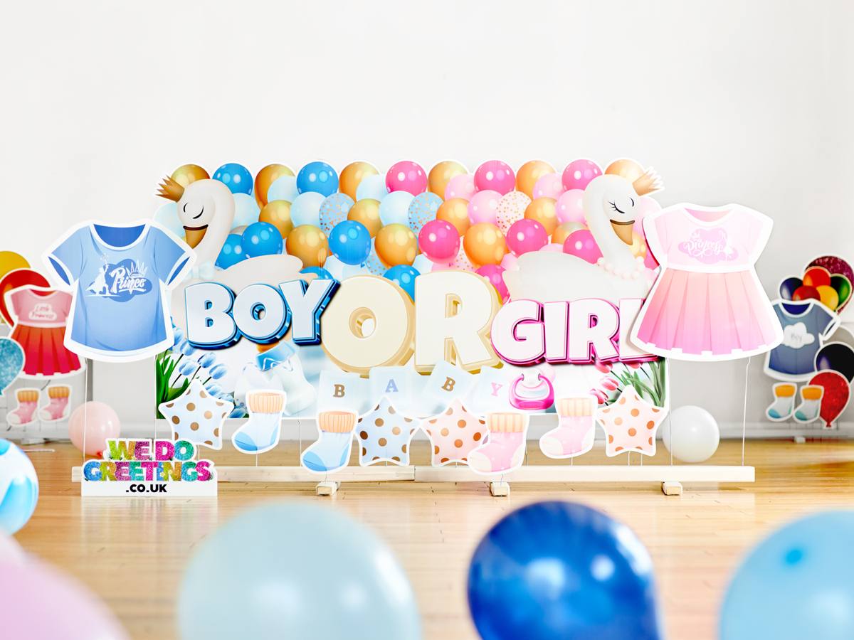 Boy or Girl? display with baby-grow and balloon accessories