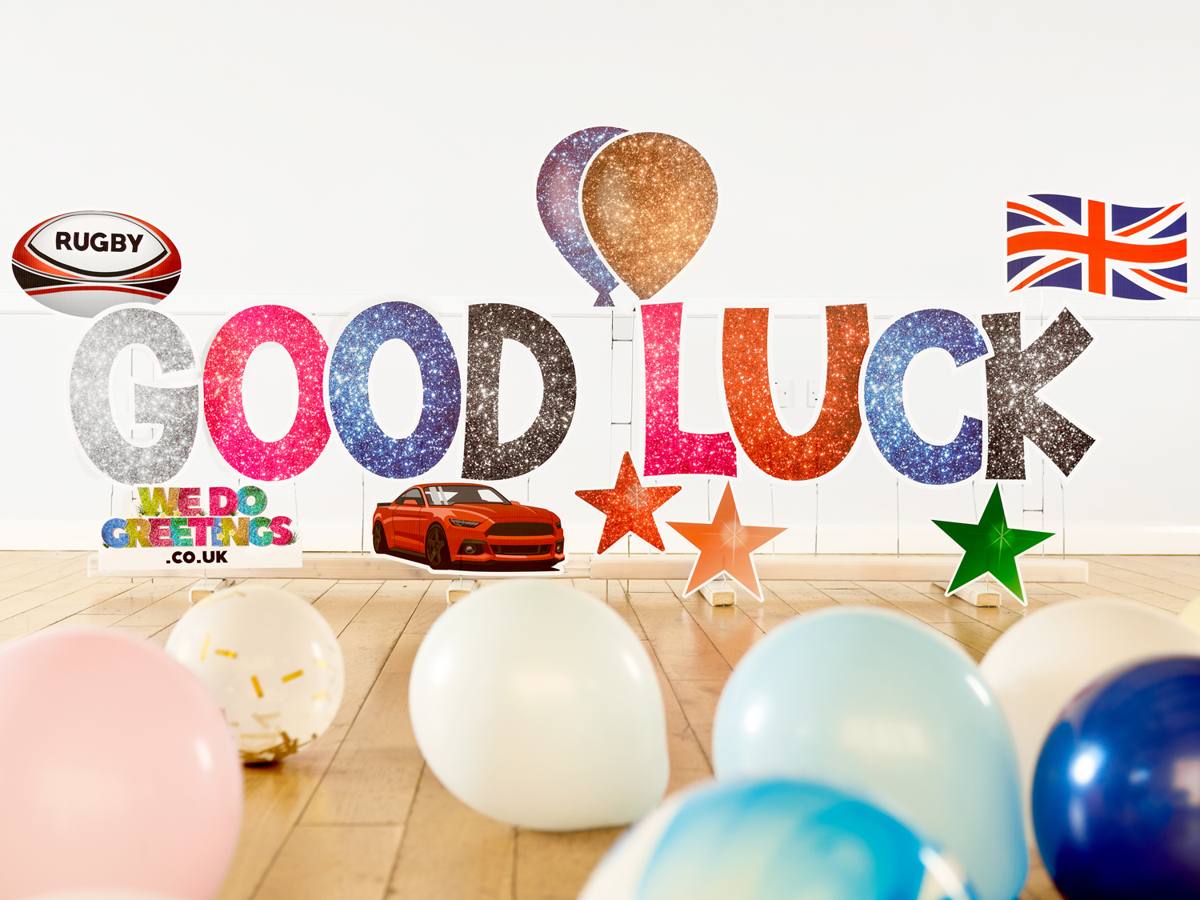 Good Luck in glitter letters with a rugby ball and Union Jack