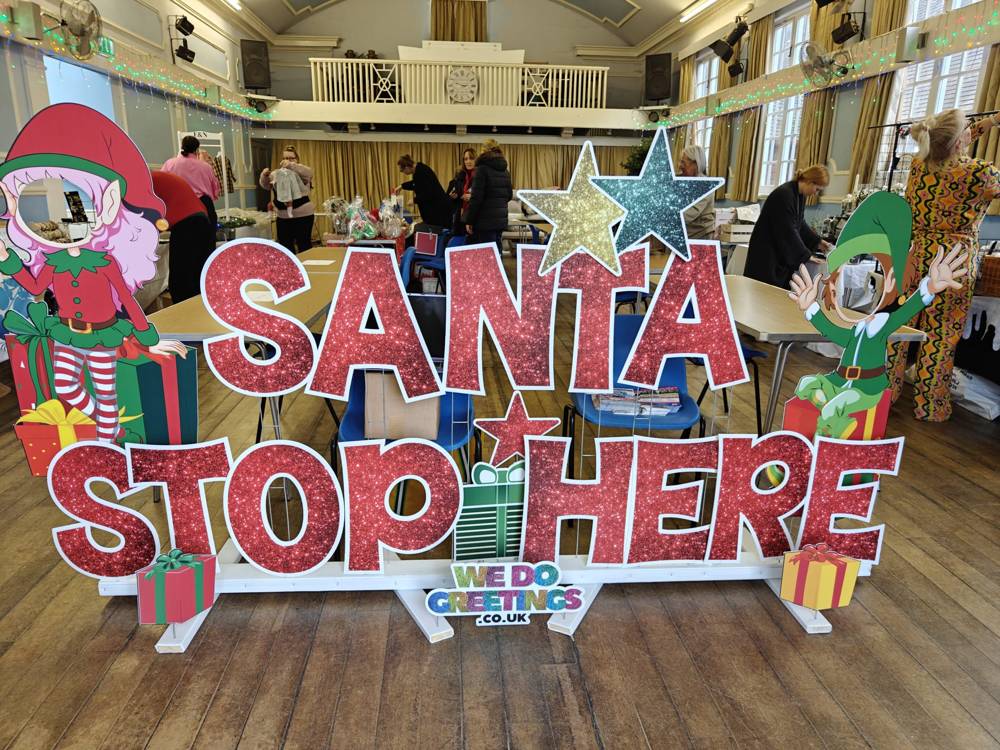 Santa Stop Here display in a hall