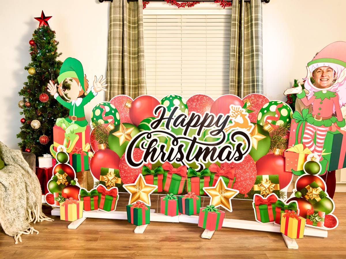 Happy Christmas backdrop with elves, presents, baubles and a Christmas tree