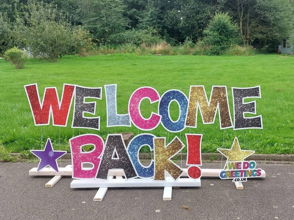 Welcome Back display on a school field
